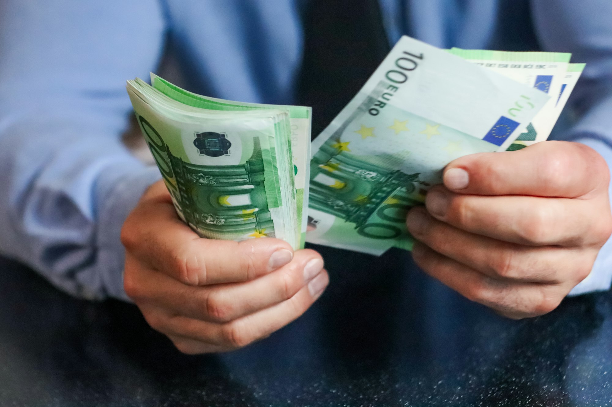 Money. Hands holding money, euro, euros, counting money, saving currency, rich,cash, hundreds,hand
